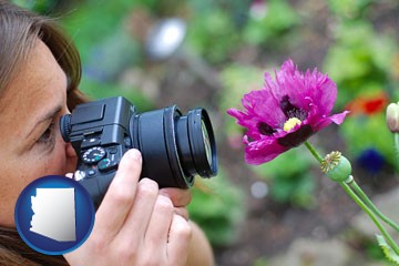 a female photographer photographing a flower close-up - with Arizona icon