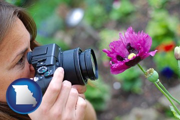 a female photographer photographing a flower close-up - with Missouri icon