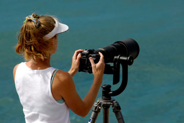 sports photographer photographing a surfing contest in Hawaii