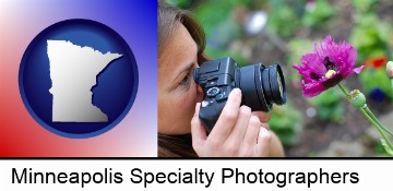 a female photographer photographing a flower close-up in Minneapolis, MN