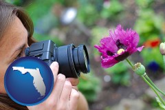florida map icon and a female photographer photographing a flower close-up