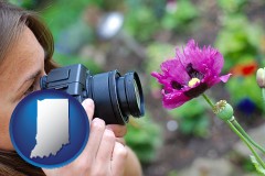 indiana map icon and a female photographer photographing a flower close-up