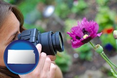 kansas map icon and a female photographer photographing a flower close-up