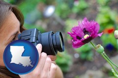 louisiana map icon and a female photographer photographing a flower close-up