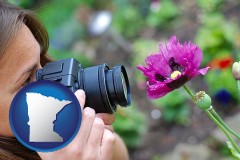 minnesota map icon and a female photographer photographing a flower close-up