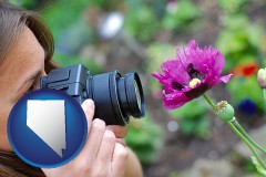 nevada map icon and a female photographer photographing a flower close-up
